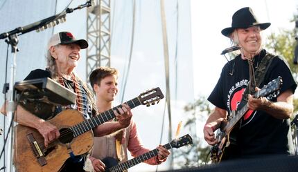 Willie Nelson, his son Lukas Nelson and Neil Young perform "This Land is Your Land" during...