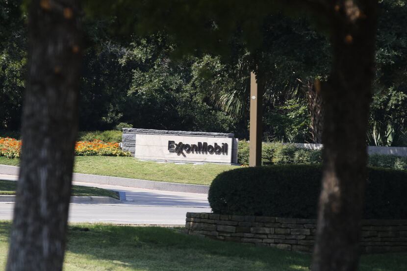 A sign marks the entrance to ExxonMobil headquarters in Irving shot on Friday, October 9,...