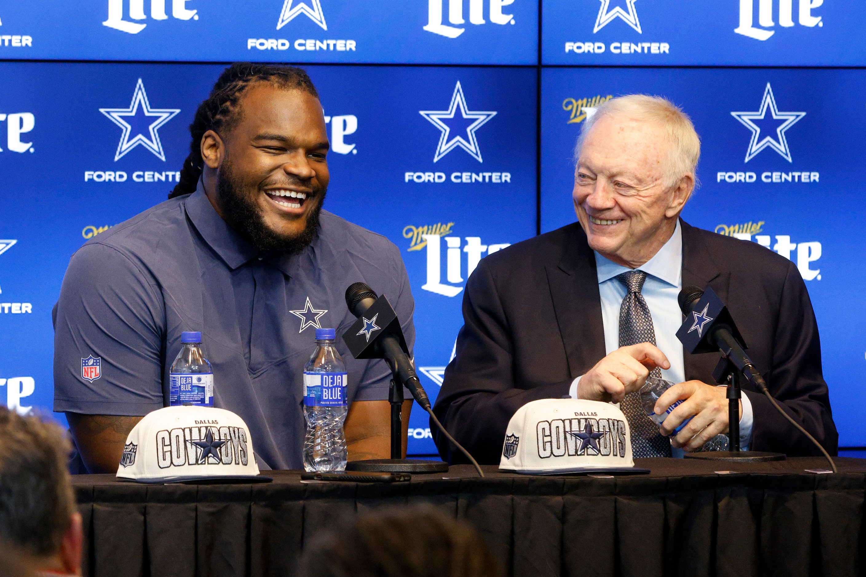 Dallas Cowboys rookie defensive tackle Mazi Smith (left) laughs next to owner Jerry Jones...