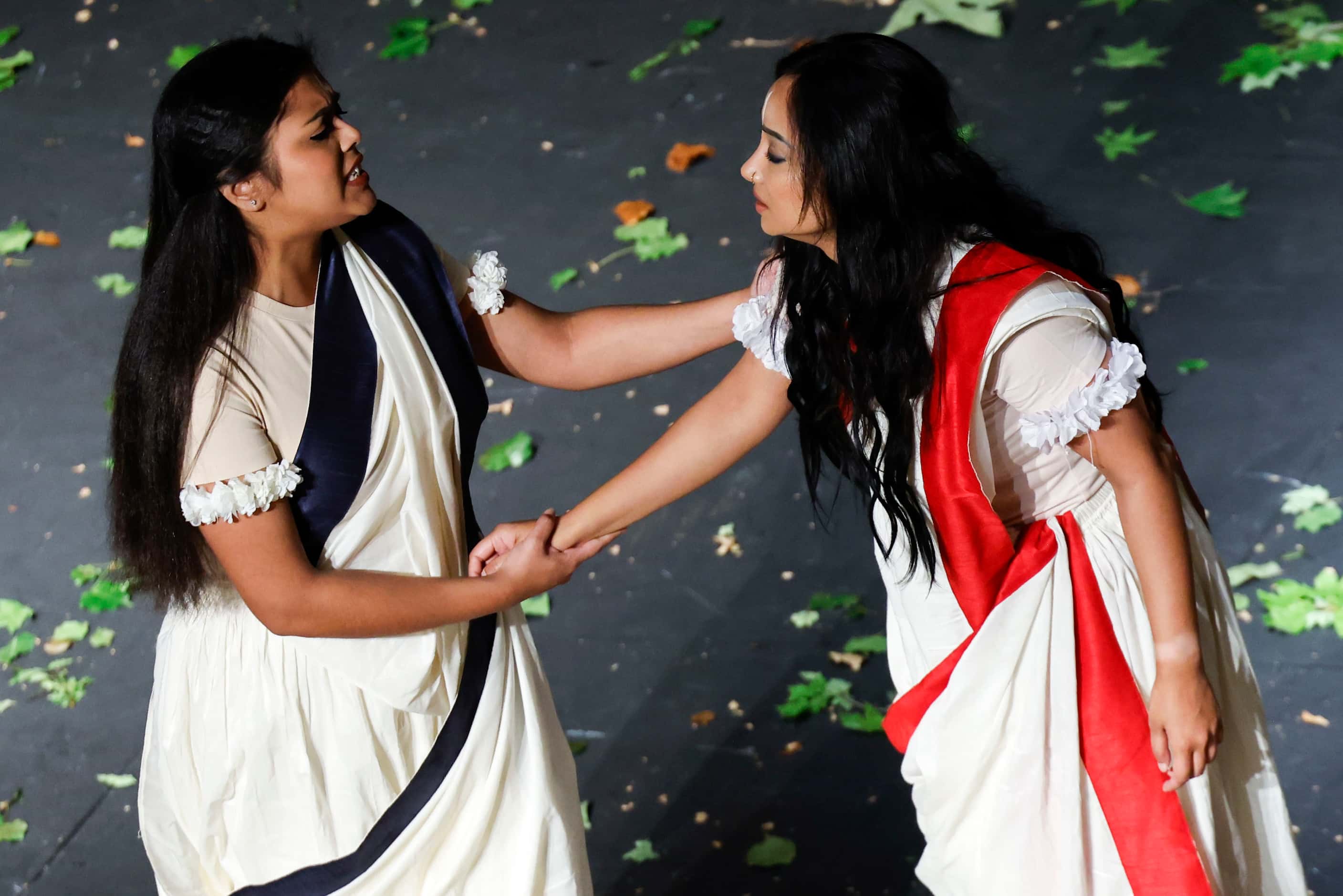 Cast members Labiba Sarker (left) of University of Texas at Arlington plays her role as...