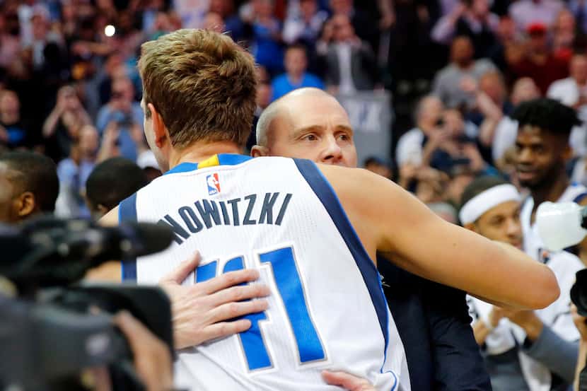 Dallas Mavericks forward Dirk Nowitzki (41) is congratulated by head coach Rick Carlisle...