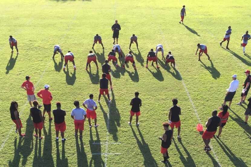 The Cedar Hill football team goes through drills during the  first day of practice.
