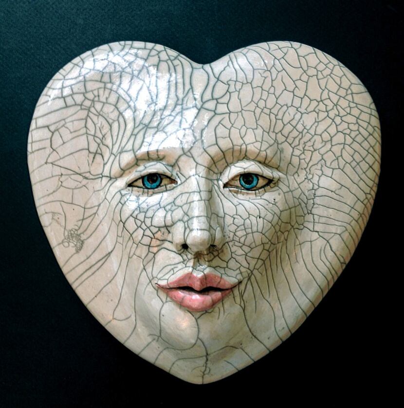 "Heart Lines," ceramic raku mask by Louise Murdock, part of the "El Corazon" (accent on the...