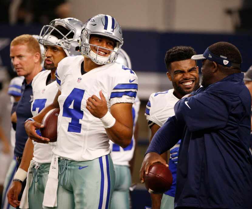 Dallas Cowboys quarterback Dak Prescott (4) jokes around before their game against the...