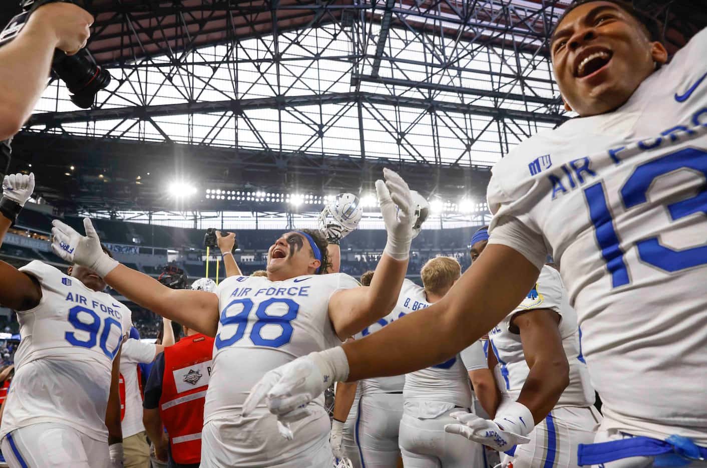 Air Force players celebrate their win against Army during an NCAA football game at Globe...