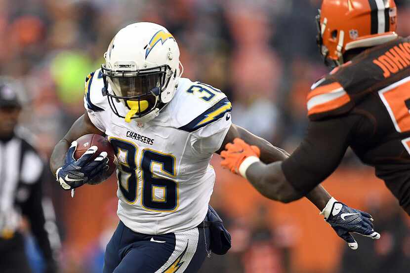 CLEVELAND, OH - DECEMBER 24:  Ronnie Hillman #36 of the San Diego Chargers rushes against...