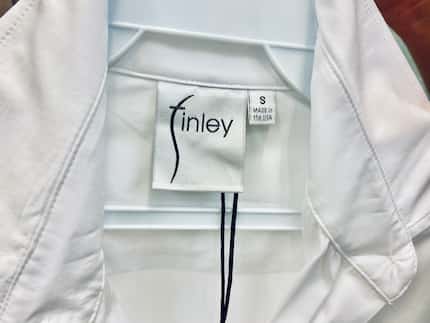 Made in the USA tag on a women's white cotton shirt by Dallas-based Finley Shirts.