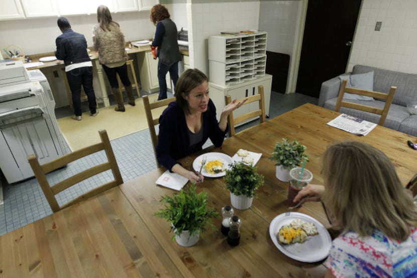 Michelle Wehrwein (left) and Julie Engel enjoy lunch in the renovated break room at McKinney...