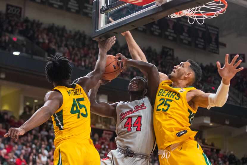 LUBBOCK, TEXAS - JANUARY 07: Guard Chris Clarke #44 of the Texas Tech Red Raiders is fouled...