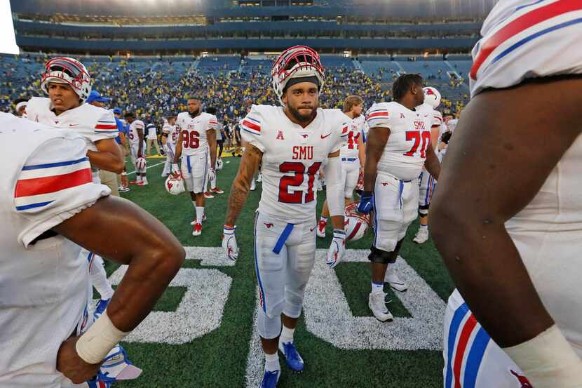 Southern Methodist Mustangs Cole Sterns (21) walks off the field after the Ponies' loss to...