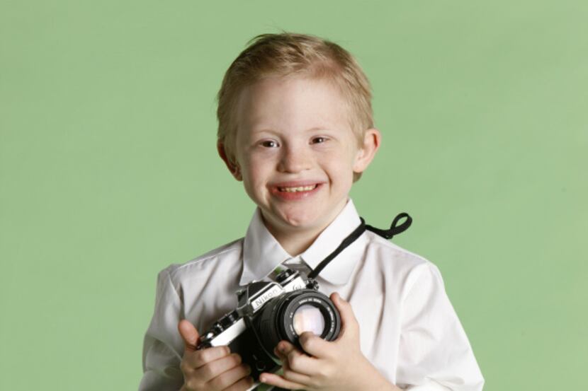 Alex White, 7, in character as a photographer for Parent's Guide to Summer, photographed...