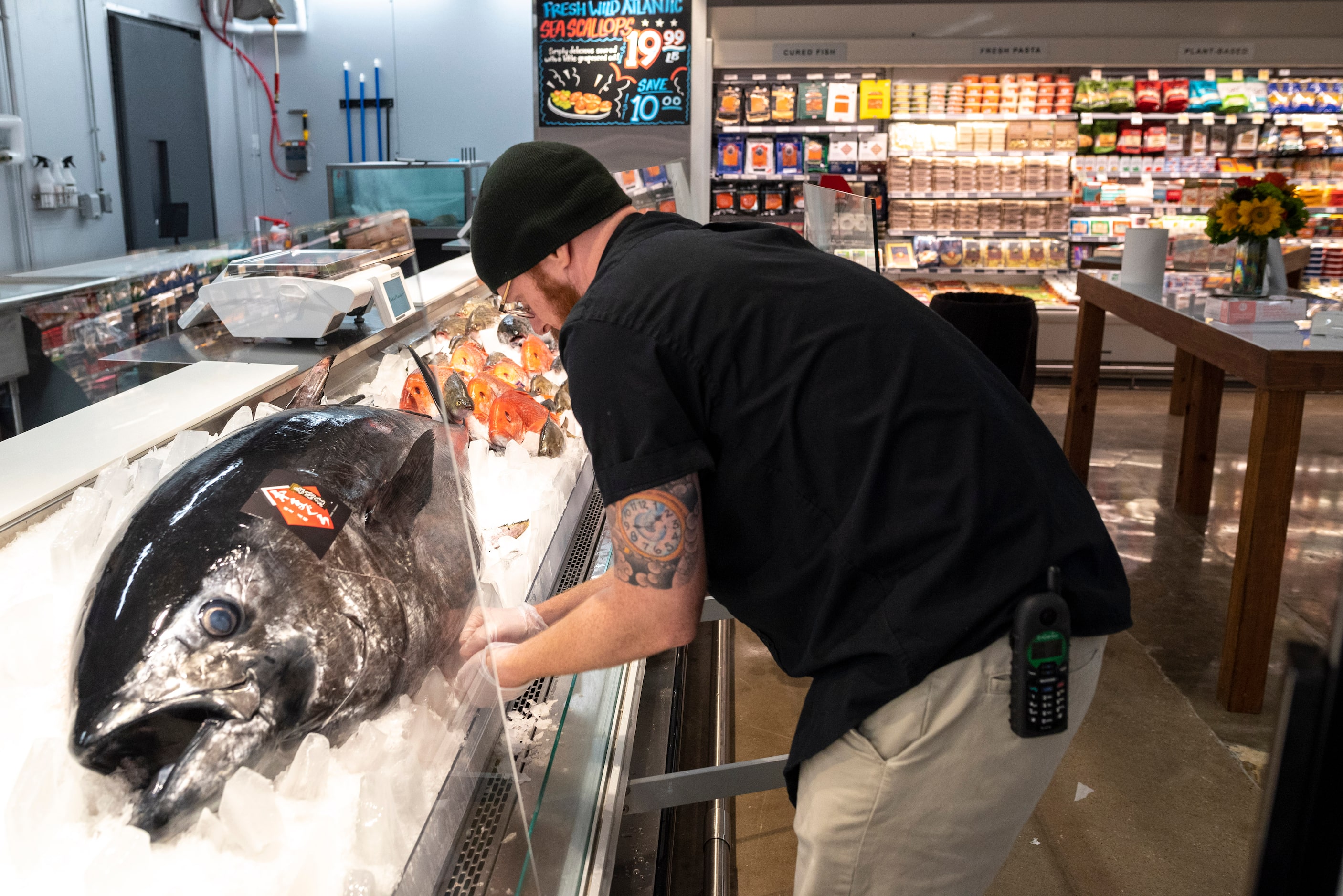 Seafood manager Lee Brady prepares a huge Takashima Bluefin Tuna displayed in the expanded...