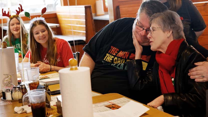 Jeremy Markle, of Bossier City, La., held his mother Robin Markle, of Forney, as his...
