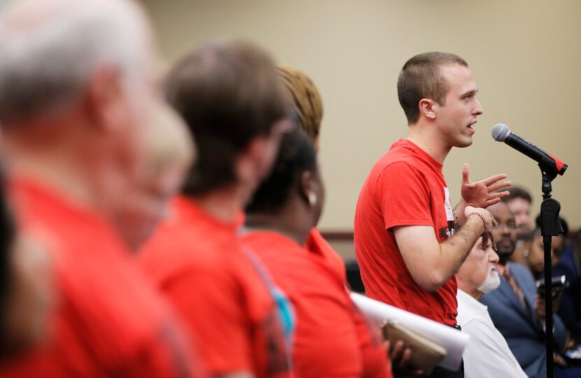 Isaac Davis, a member of the North Texas Democratic Socialists, speaks in favor of a 3...