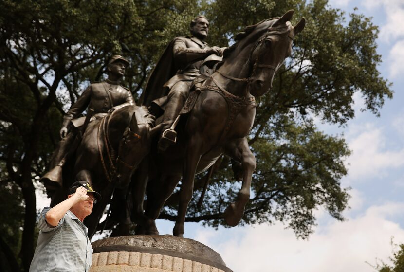 A visitor gives the "palm out" Confederate salute while being photographed at Robert E. Lee...