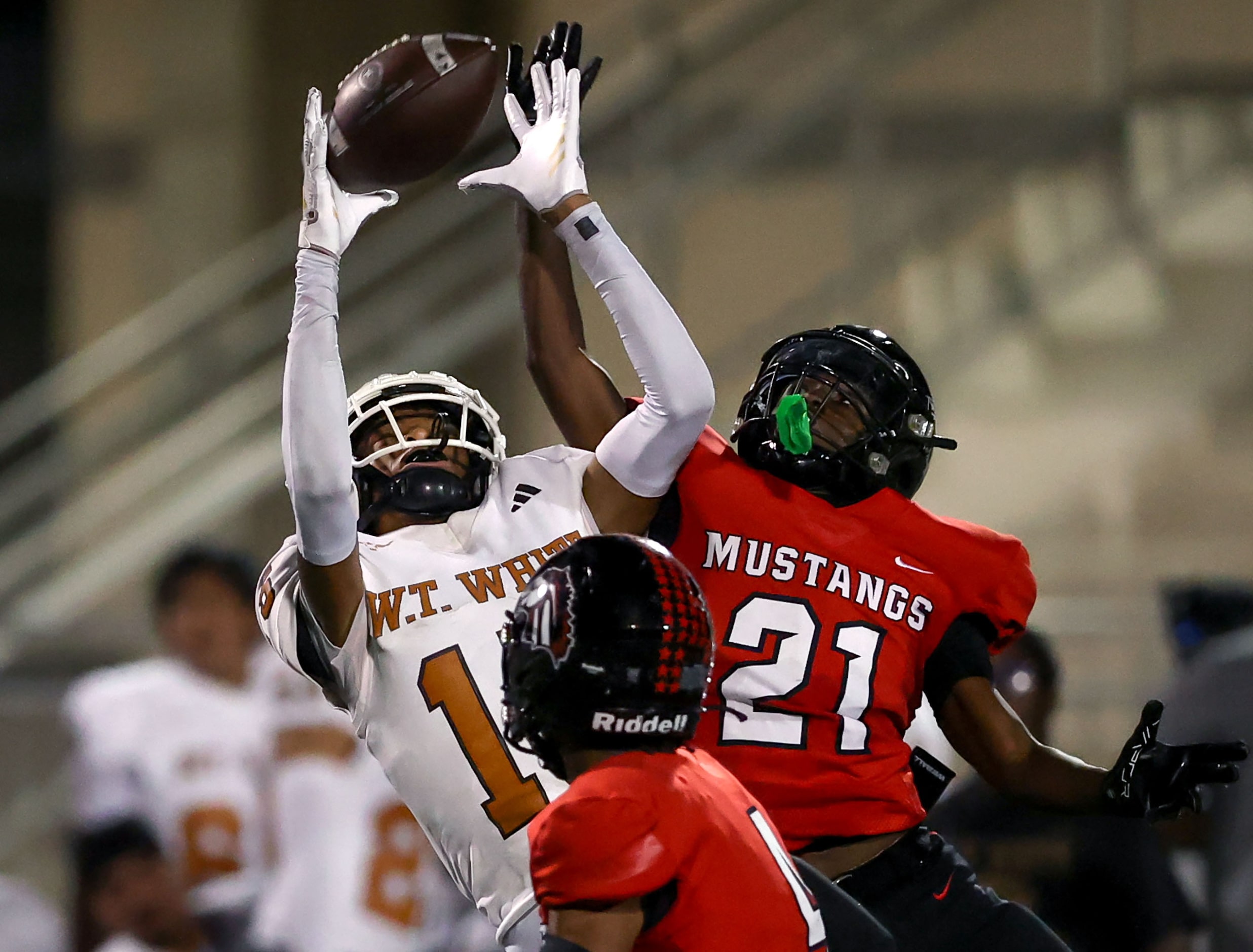 W.T. White wide receiver Lovell Neal (15) goes up to grab a reception against Creekview...