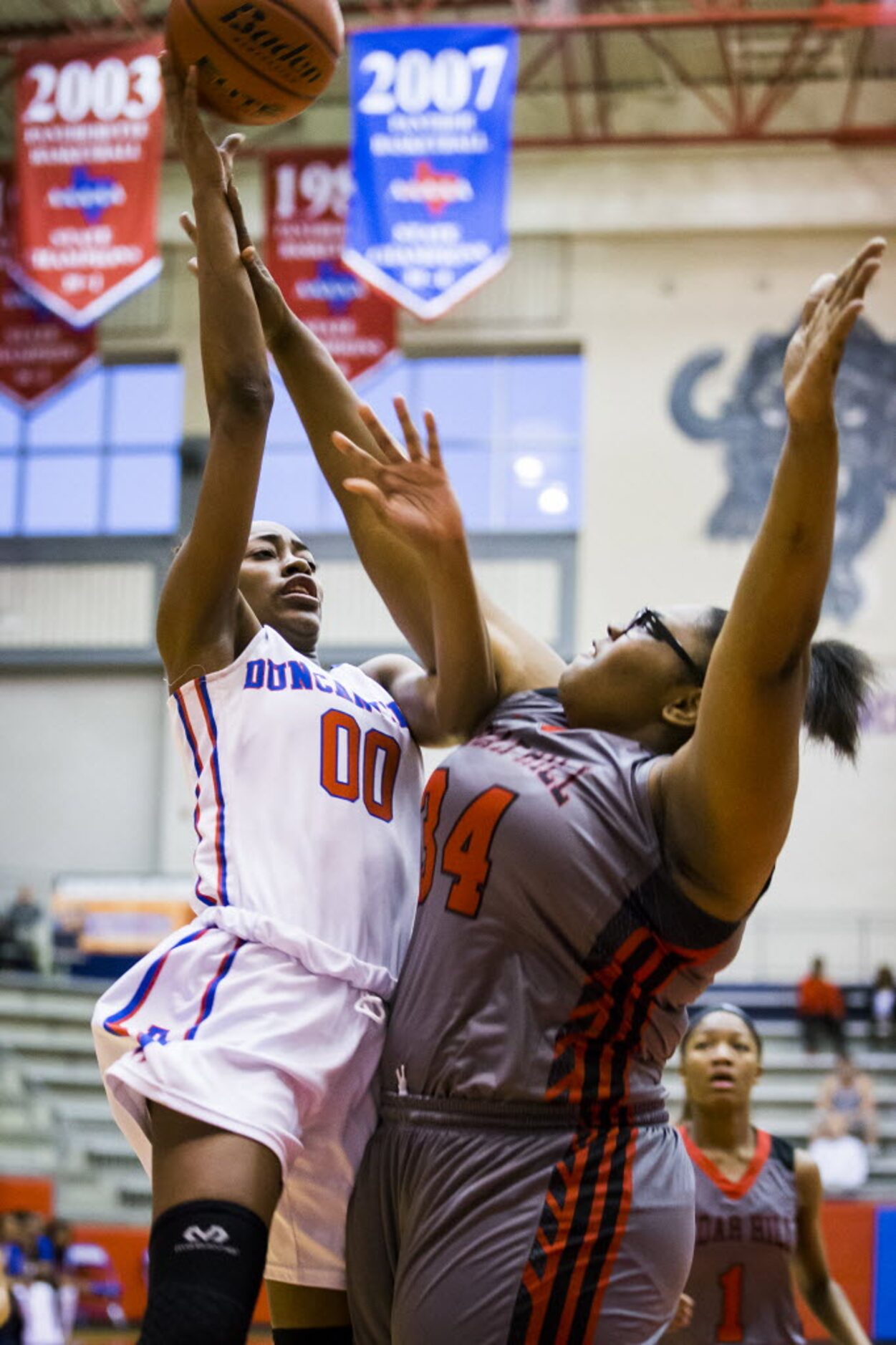 Duncanville forward Zarielle Green (00) puts up a shot against Cedar Hill Courtney Thomas...