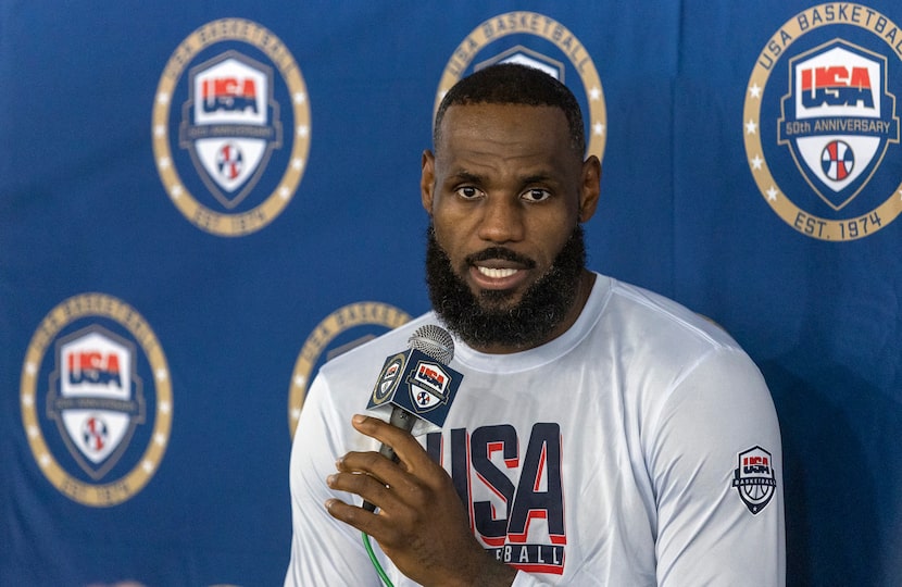 LeBron James, of the Los Angeles Lakers, responds to a question from a reporter during...