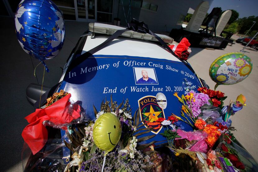 A Lancaster police car was decorated in memory of slain police Officer Craig Shaw in...