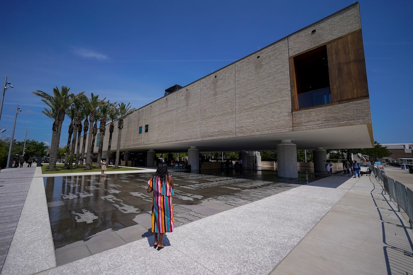 A visitor takes a picture at June's opening of the International African American Museum in...