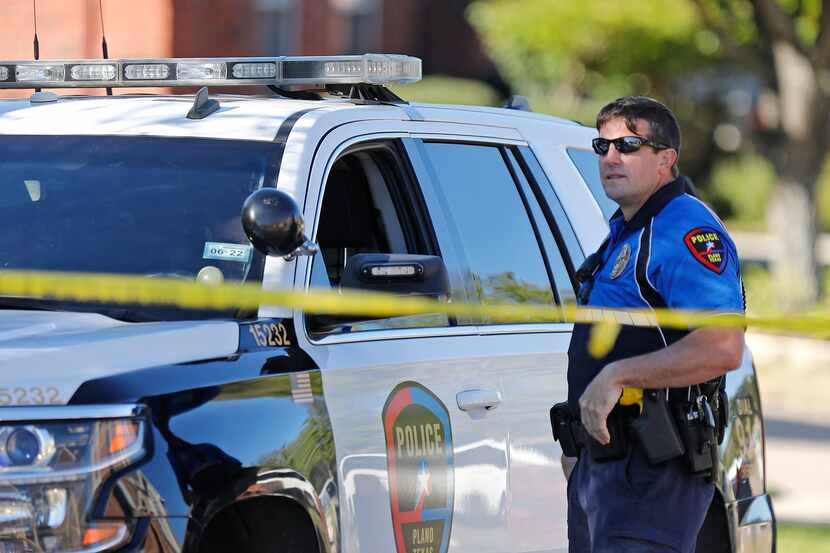 Plano Police keep the street blocked off near the residence in 5800 block of Mulvane Dr. in...