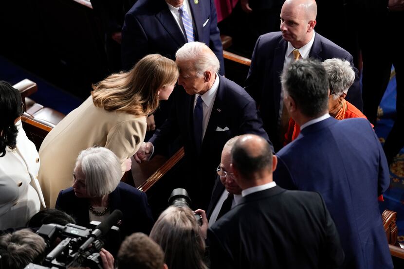 President Joe Biden talks with Rep. Lizzie Pannill Fletcher, D-Houston, as he leaves after...