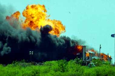 The Branch Davidian compound was rocked by an explosion after the Davidians set fire to it...