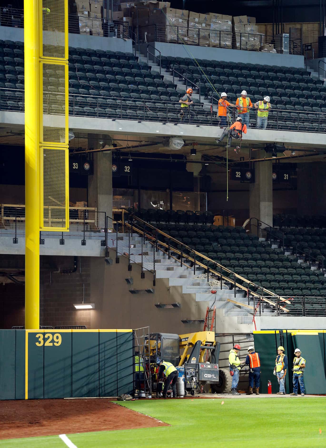 Construction workers finish out parts of the new Globe Life Field under construction in...