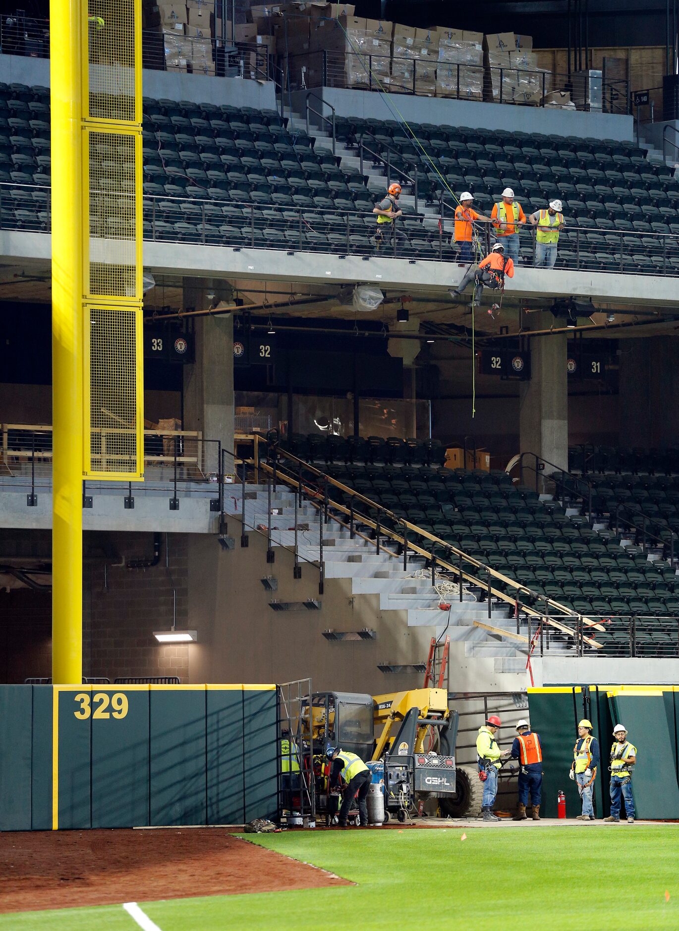 Construction workers finish out parts of the new Globe Life Field under construction in...