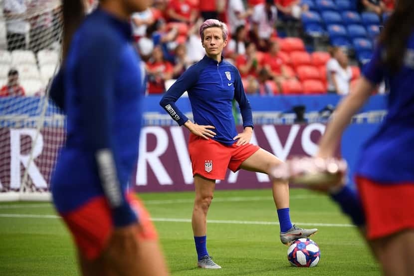 TOPSHOT - United States' forward Megan Rapinoe looks on during warm up prior to the  France...