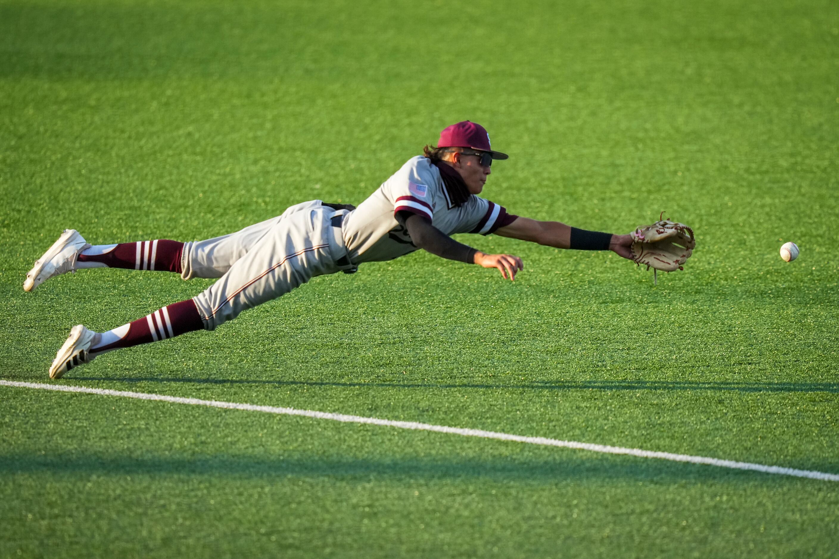 Sinton second baseman Marco Gonzales can’t make a diving play on a single by Argyle...