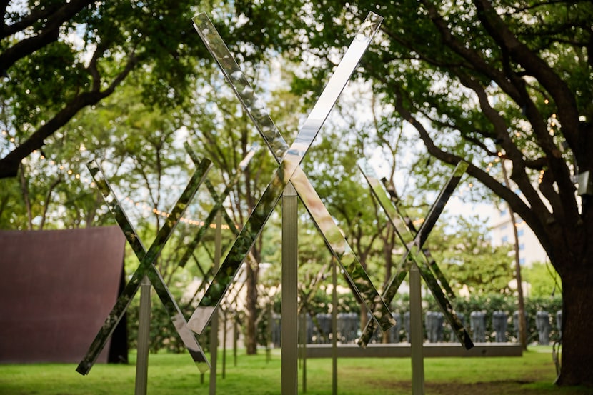 In "Stream Trace," a series of stainless steel posts planted along the path of the hidden...