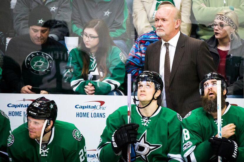 Dallas Stars coach Lindy Ruff watches from the bench during the second period of an NHL...