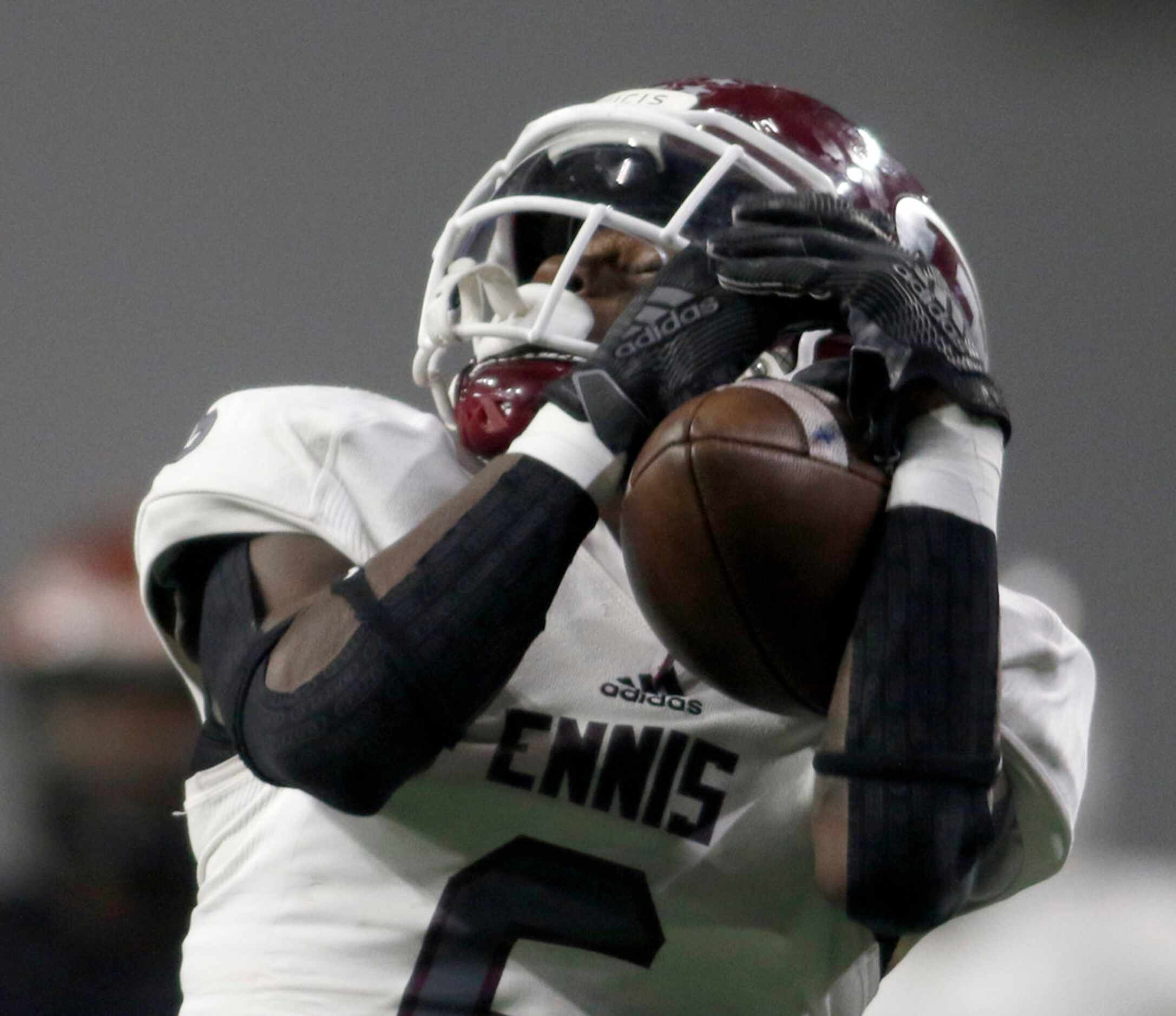 Ennis receiver Karon Smith (6) pulls in a long reception during second quarter action...