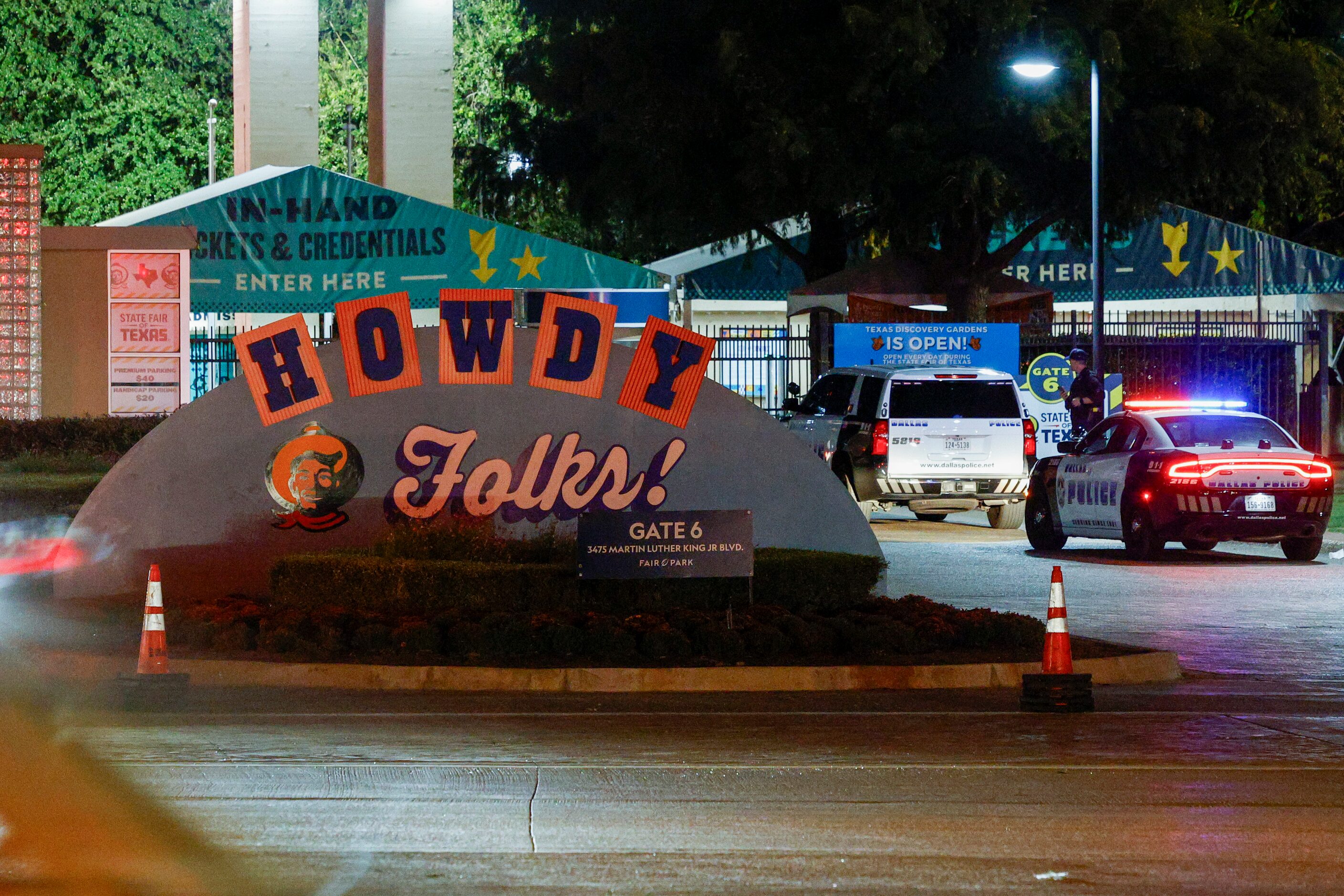 Dallas police block an entrance to the State Fair of Texas after a shooting, Saturday, Oct....