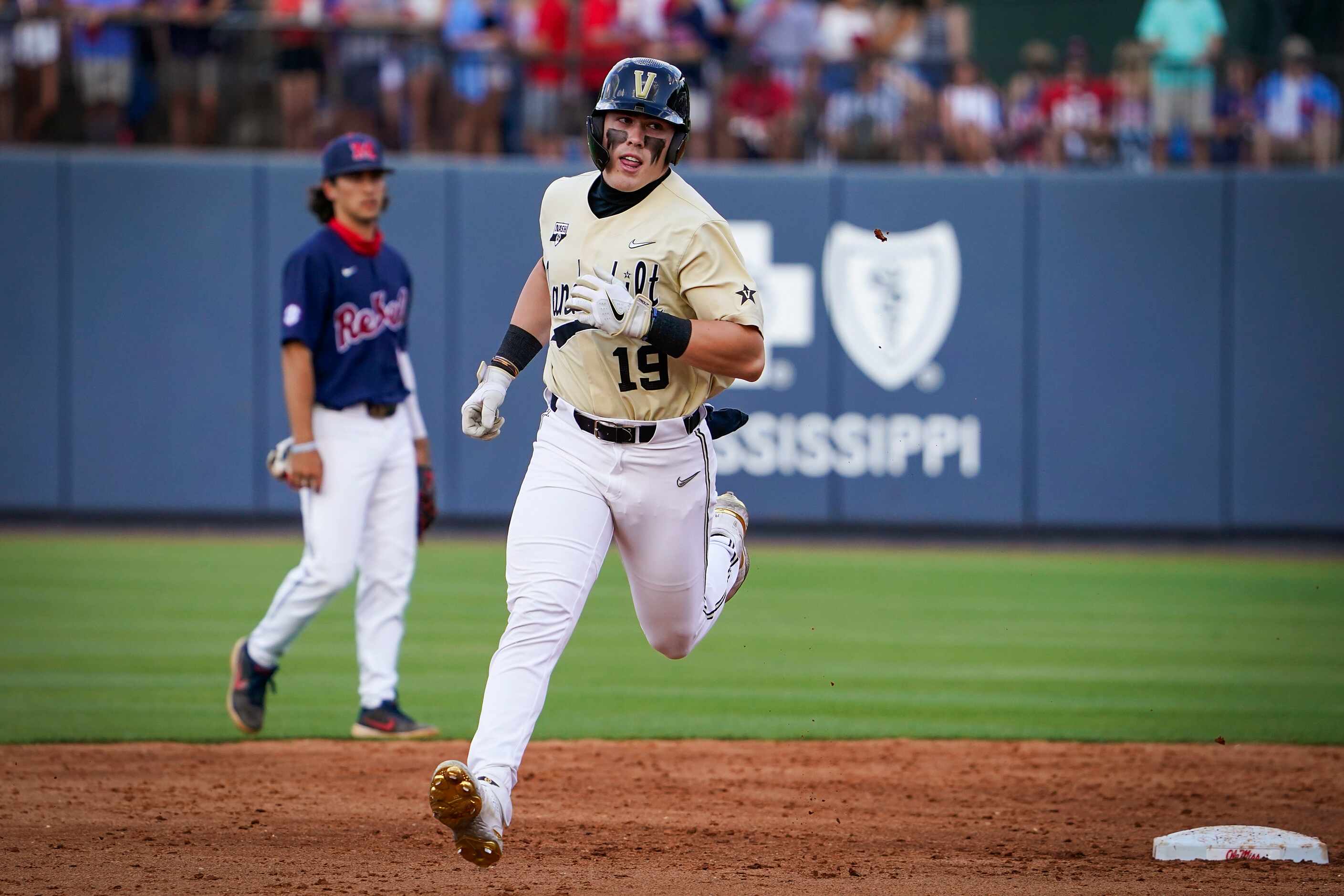 Vanderbilt outfielder Troy LaNeve rounds the bases after hitting on or the Commodores seven...