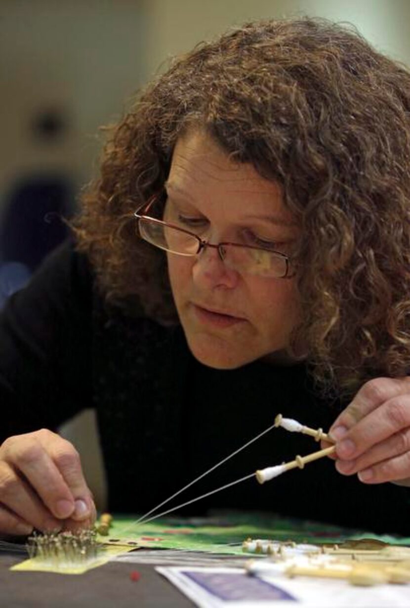 
Dorothy Morgan of Forney works on her lace during the society’s weekly meeting. 
