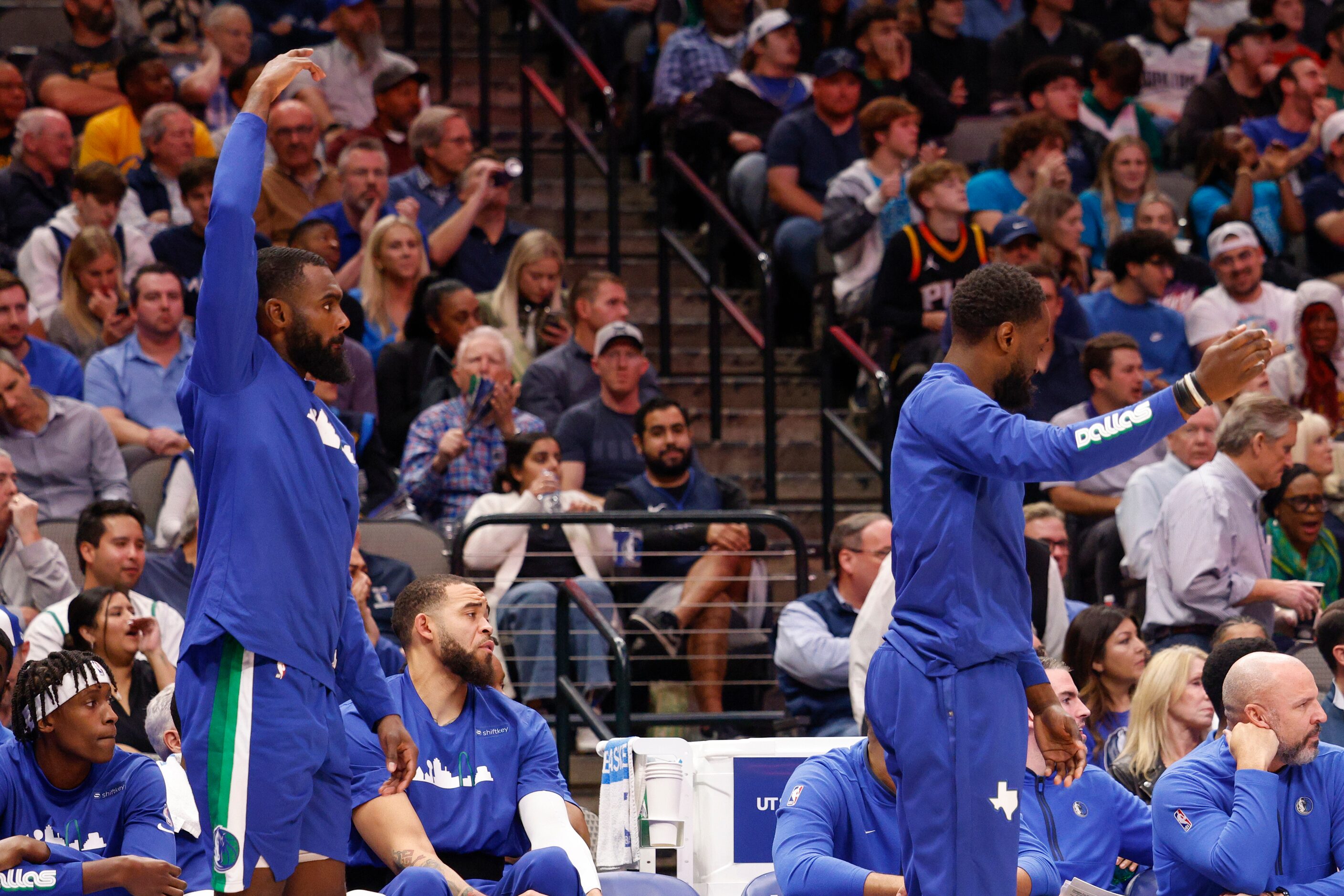 Dallas Mavericks forward Tim Hardaway Jr. (left) and guard Theo Pinson (1) stand as they...