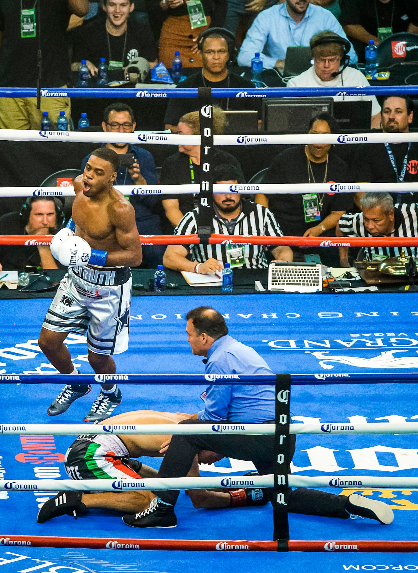 Welterweight champion Errol Spence Jr. celebrates after defending his IBF world title with a...