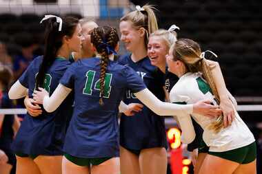 Frisco Reedy celebrate gaining a point against Frisco Wakeland during the second set of a...