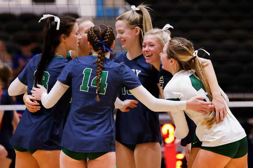 Frisco Reedy celebrate gaining a point against Frisco Wakeland during the second set of a...