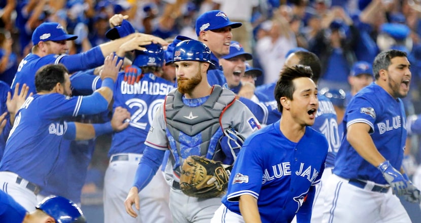 Texas Rangers catcher Jonathan Lucroy (25) walks off the field as the Toronto Blue Jays...