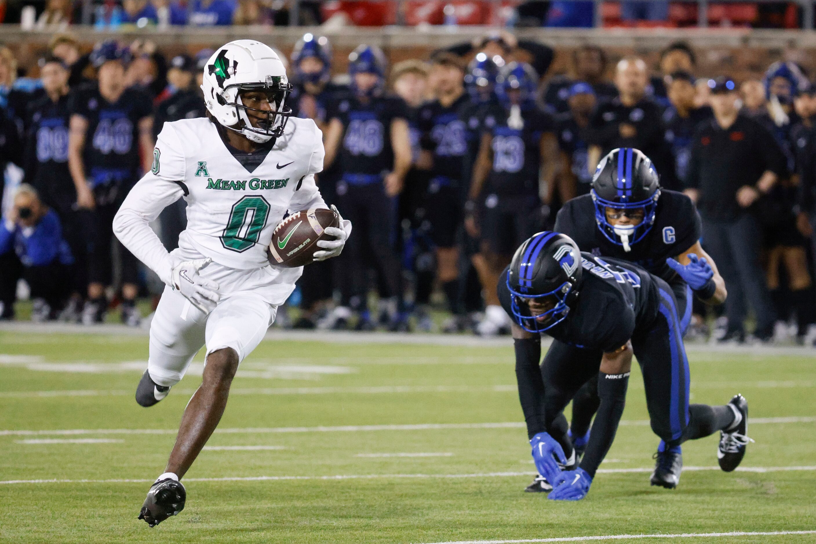 North Texas Mean Green wide receiver Blair Conwright (left) runs to score a touchdown...