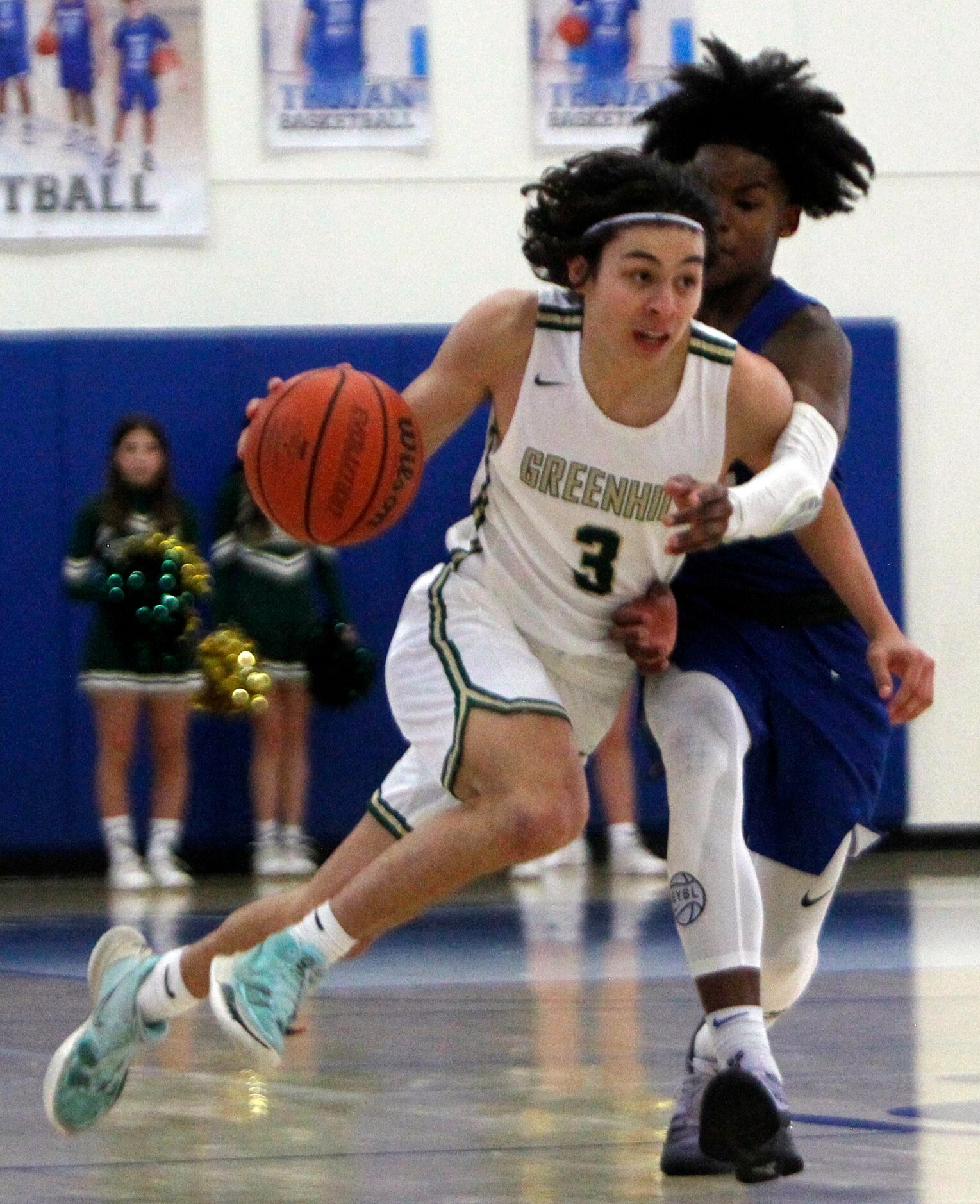 Greenhill's Ryan Saqueton (3) drives to the basket during first quarter action against...