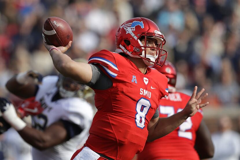 DALLAS, TX - NOVEMBER 26:  Ben Hicks #8 of the Southern Methodist Mustangs throws against...