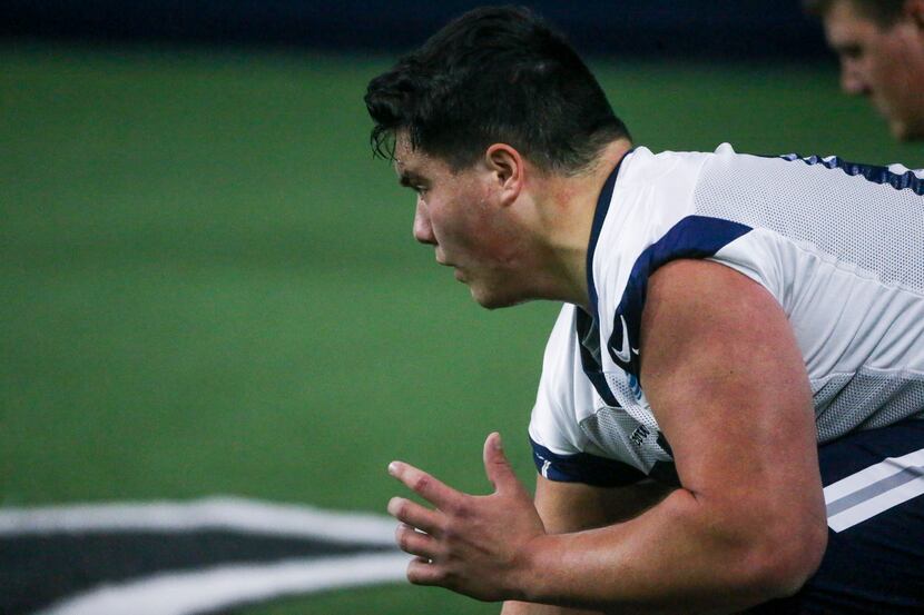 FILE - Cowboys offensive lineman Connor McGovern runs through a drill during a rookie...