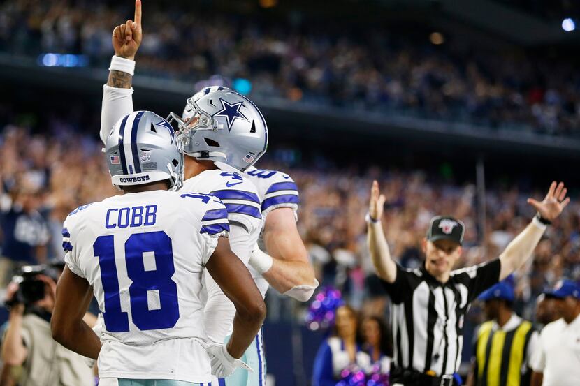 Dallas Cowboys quarterback Dak Prescott (4) celebrates after scoring a touchdown with...