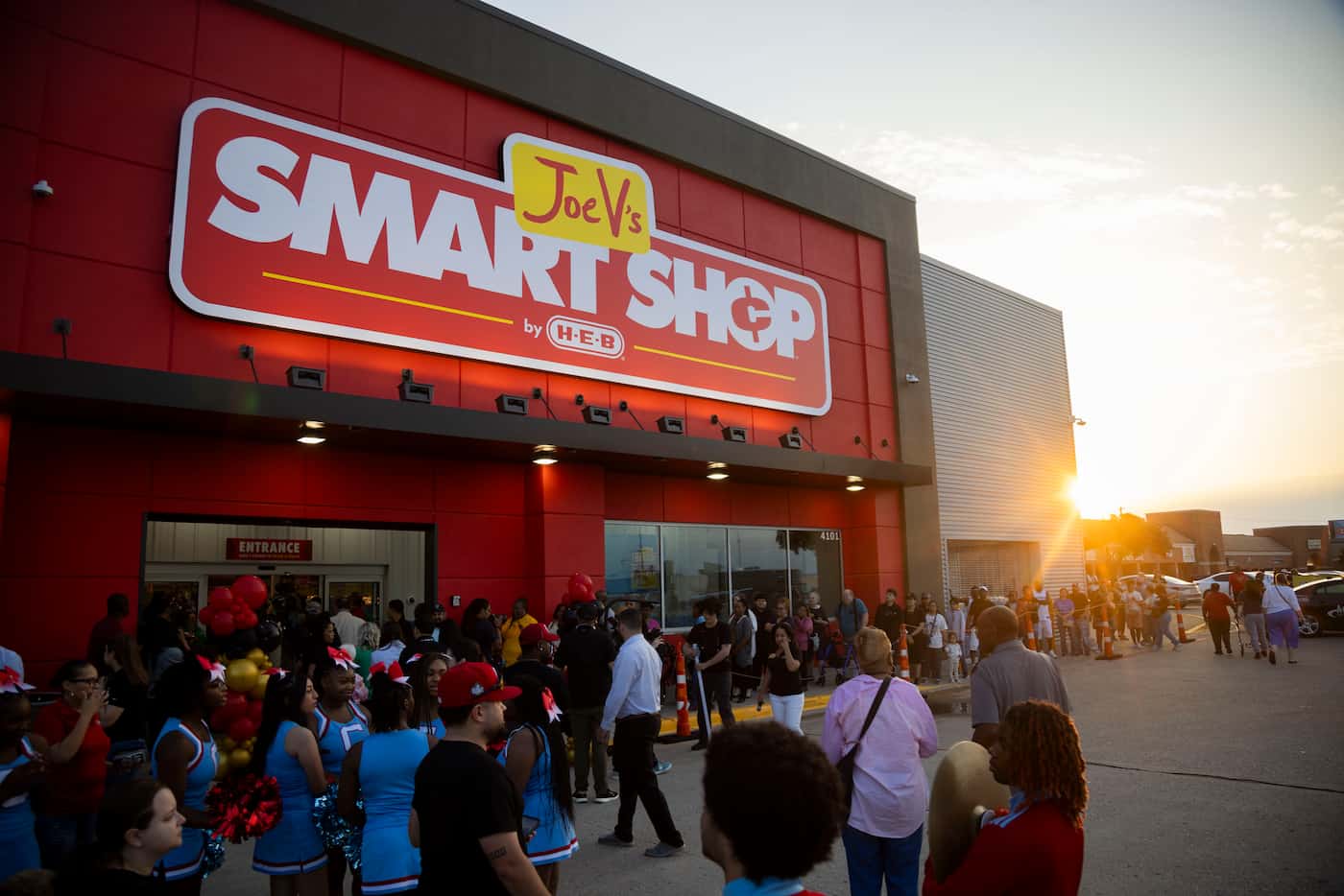 People wait outside before the grand opening of Joe V's Smart Shop on Wednesday, June 12,...