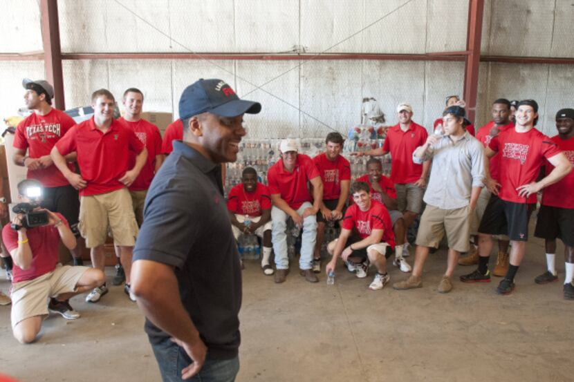 Lancaster Mayor Marcus Knight, foreground, thanked the Texas Tech football players and...