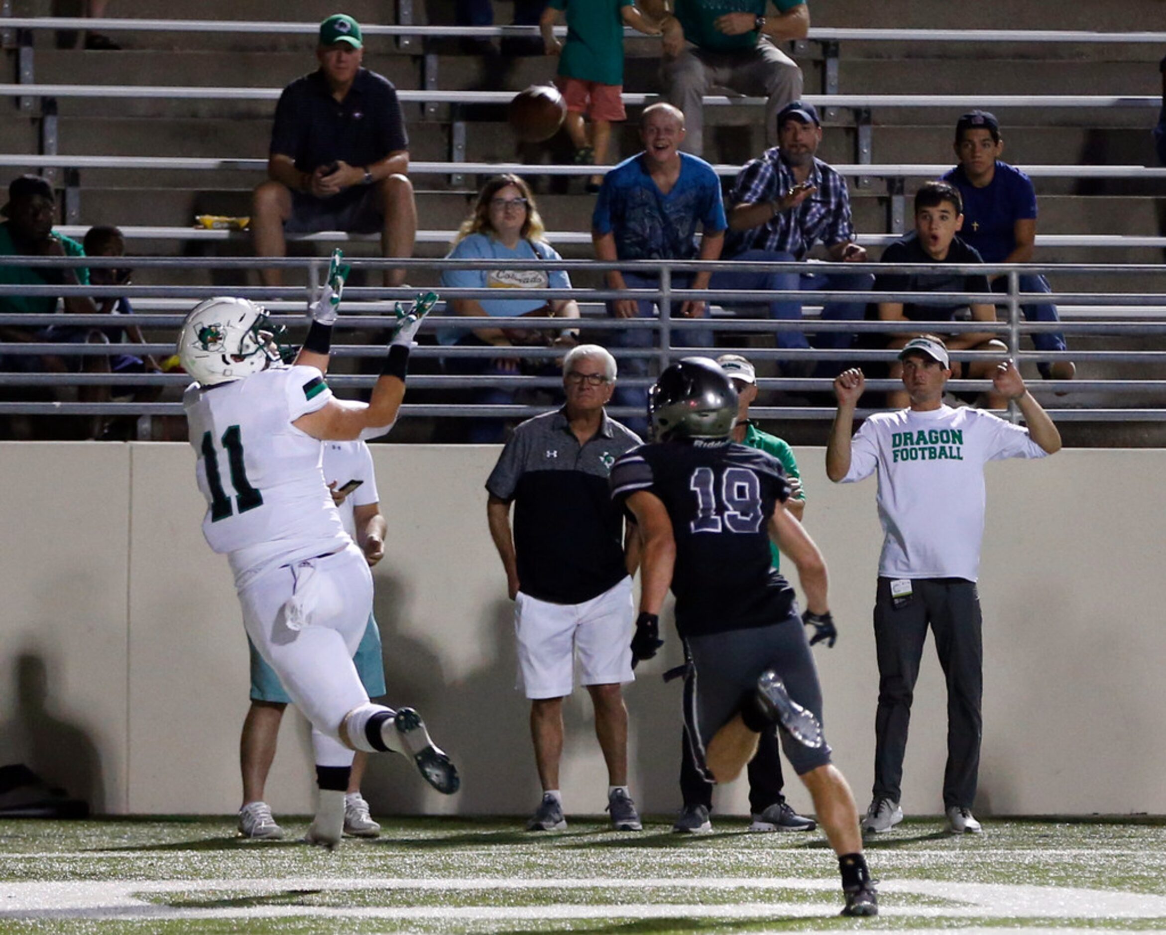 Southlake Carroll's Blake Smith (11) prepares to catch a touchdown in front of Denton...